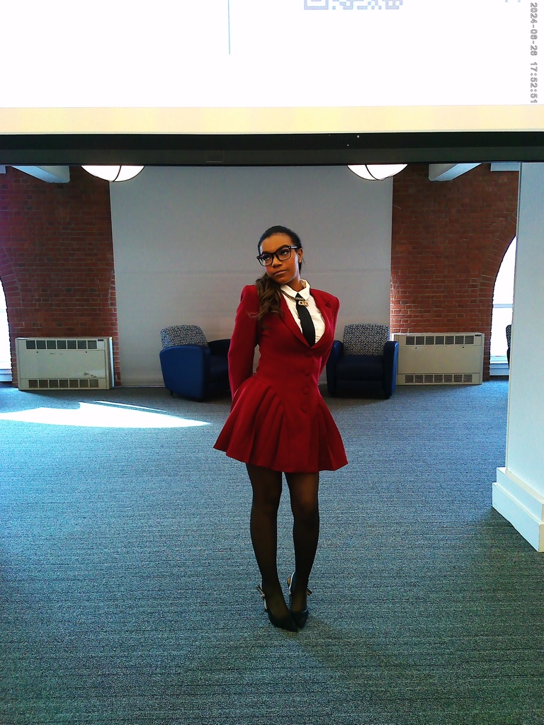 Jaychele Nicole in a burgundy suit