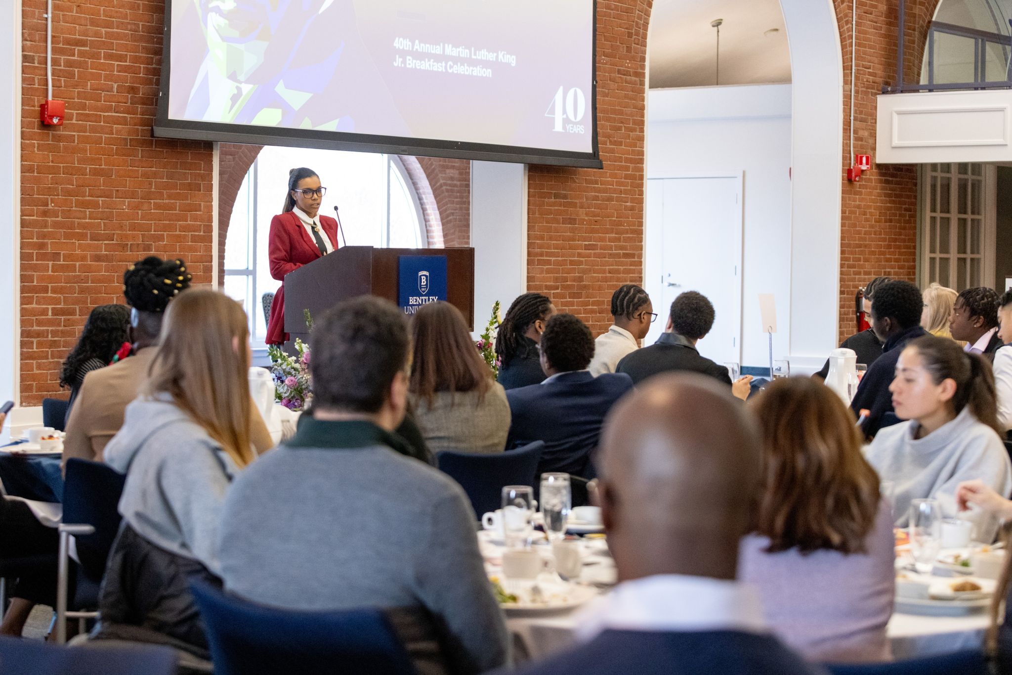 Jaychele delivering the student keynote at Bentley’s 40th Annual Martin Luther King Jr. Breakfast